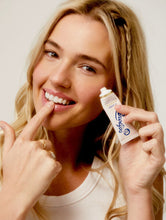 Load image into Gallery viewer, Model holding the 101 Ointment Original Multipurpose Superbalm.
