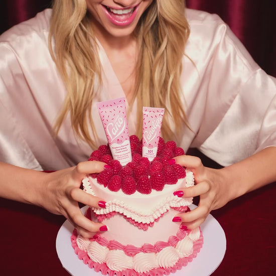 Video of model eating the raspberry shortcake with her hands. The Lanolips 101 Ointment Multi-Balm Raspberry Shortcake and the Raspberry Shortcake Hand & Body Cream are featured in the limited edition Lanolips Raspberry Shortcake Holiday Duo. 