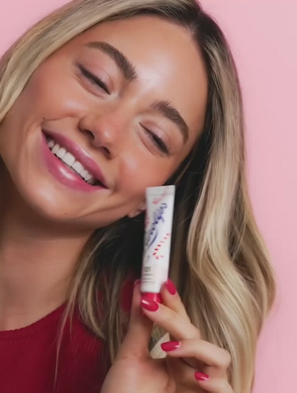 Video of model using the Lanolips 101 Ointment Multi-Balm Candy Cane, a limited edition festive gourmand flavour. 