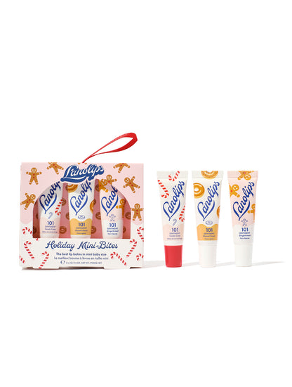 Lanolips Holiday Mini Bites with the trio set shown against a white background: 101 Ointment Multi-Balm Candy Cane, Glazed Donut and Gingerbread. Our iconic 101 Ointments have now been infused with a festive twist, but still packed with rich lanolin, vitamin-e and natural flavours. 