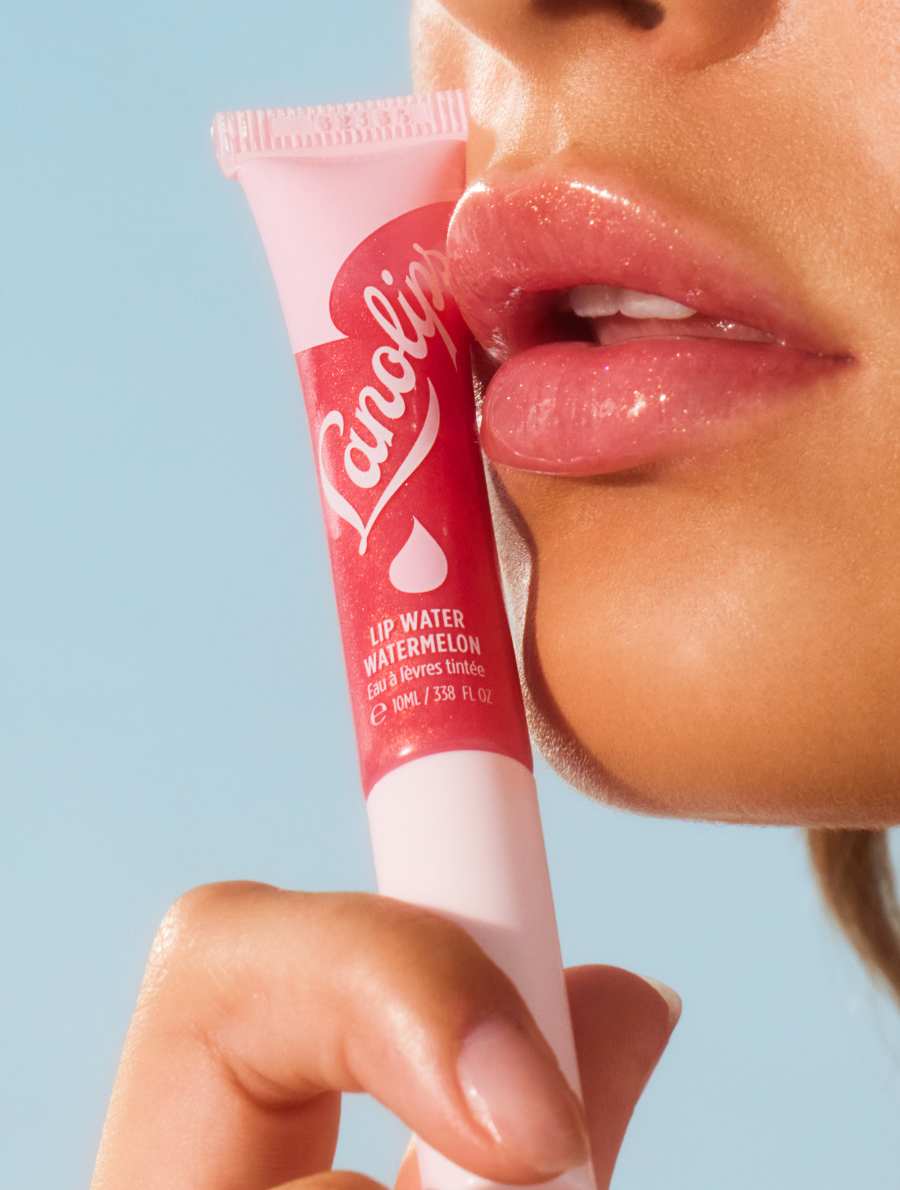 Model wearing Lanolips Lip Water Watermelon